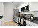 Bright kitchen features stainless steel appliances, granite countertops, and white cabinetry at 5000 Culbreath Key Way # 8-319, Tampa, FL 33611