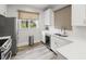 Modern kitchen featuring stainless steel appliances, white cabinetry and countertops, and natural lighting at 5000 Culbreath Key Way # 8-319, Tampa, FL 33611