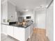 Bright kitchen boasts black granite countertops, white cabinets, and modern stainless steel appliances at 5000 Culbreath Key Way # 8-319, Tampa, FL 33611