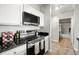 Updated kitchen features granite countertops and stainless steel appliances, offering modern convenience at 5000 Culbreath Key Way # 8-319, Tampa, FL 33611