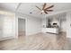 Open-concept living room showcasing the hard surface floors and kitchen at 5000 Culbreath Key Way # 8-319, Tampa, FL 33611