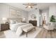 Serene main bedroom with a comfortable bed, ceiling fan, and an ensuite bathroom at 5000 Culbreath Key Way # 8-319, Tampa, FL 33611
