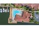The community pool is shaped like an L and is surrounded by lounge chairs at 5000 Culbreath Key Way # 8-319, Tampa, FL 33611