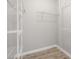 Walk-in closet with white shelving and hardwood floors, offering ample storage space at 5000 Culbreath Key Way # 8-319, Tampa, FL 33611