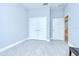 Well-lit bedroom featuring tile flooring and double closets at 5732 Stockport St, Riverview, FL 33578