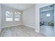 Bright dining room featuring tile flooring, a modern chandelier, and large windows at 5732 Stockport St, Riverview, FL 33578