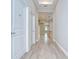 Bright entryway featuring wood-look tile flooring, neutral wall paint and an open view of the home at 5732 Stockport St, Riverview, FL 33578