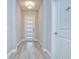 Bright entryway featuring wood-look tile flooring, a modern front door and neutral wall paint at 5732 Stockport St, Riverview, FL 33578