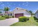 Charming single-story home featuring a well-manicured lawn, neat shrubbery and an attached two car garage at 5732 Stockport St, Riverview, FL 33578