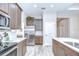 Spacious kitchen with wood cabinets, quartz countertops and stainless steel appliances at 5732 Stockport St, Riverview, FL 33578