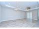 Bright living room featuring tile flooring, a ceiling fan, recessed lighting, and sliding glass doors at 5732 Stockport St, Riverview, FL 33578