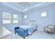 Well-lit main bedroom featuring tile flooring, tray ceiling, and plenty of natural light at 5732 Stockport St, Riverview, FL 33578