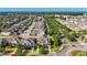 A high-density residential neighborhood featuring numerous rooftops amidst a lush green canopy at 5807 Circa Fishhawk Blvd, Lithia, FL 33547