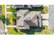 Aerial view of a landscaped property with a complex roof design in a suburban neighborhood at 5807 Circa Fishhawk Blvd, Lithia, FL 33547