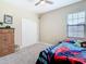 Cozy bedroom with carpet flooring, natural light, and Spiderman-themed bedding at 5807 Circa Fishhawk Blvd, Lithia, FL 33547