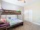 Comfortable bedroom with bunk beds, a ceiling fan, and closet for ample storage at 5807 Circa Fishhawk Blvd, Lithia, FL 33547