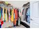 Walk-in closet with ample storage, featuring an abundance of hanging clothes at 5807 Circa Fishhawk Blvd, Lithia, FL 33547