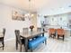 Charming dining area featuring a modern table with seating and a view into the updated kitchen at 5807 Circa Fishhawk Blvd, Lithia, FL 33547
