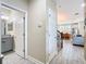 Inviting entryway features modern tile flooring and provides access to a bathroom and the main living area at 5807 Circa Fishhawk Blvd, Lithia, FL 33547