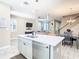 Spacious kitchen island overlooking the living room and dining area, creating an open, flowing space at 5807 Circa Fishhawk Blvd, Lithia, FL 33547