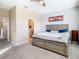 Comfortable main bedroom featuring a king-sized bed and an ensuite bathroom at 5807 Circa Fishhawk Blvd, Lithia, FL 33547