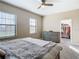 Spacious main bedroom with neutral tones, large windows, and a view to the walk-in closet at 5807 Circa Fishhawk Blvd, Lithia, FL 33547