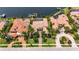 Stunning waterfront home with a private dock, mature landscaping, and a beautiful tile roof at 624 Balibay Rd, Apollo Beach, FL 33572