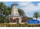 Attractive gated entrance to the MiraBay community with lush landscaping and a charming lighthouse structure at 624 Balibay Rd, Apollo Beach, FL 33572