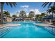 Lovely community pool featuring a lighthouse structure, waterslides, and plenty of room for swimming and lounging at 624 Balibay Rd, Apollo Beach, FL 33572