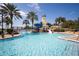 Beautiful community pool area with a lighthouse, water slides, and ample space for relaxing and enjoying the water at 624 Balibay Rd, Apollo Beach, FL 33572
