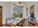 Formal dining room featuring dark wood floors, beautiful decor, and arched doorways into the living spaces at 624 Balibay Rd, Apollo Beach, FL 33572
