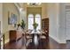Elegant dining room boasting high ceilings, hardwood floors, and ample natural light at 624 Balibay Rd, Apollo Beach, FL 33572