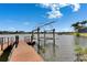 Private boat dock with a boat lift offering direct access to the open water and waterfront living at 624 Balibay Rd, Apollo Beach, FL 33572