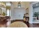 Grand entrance foyer with hardwood floors, dining room access, and double doors at 624 Balibay Rd, Apollo Beach, FL 33572