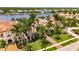 Exterior of a home with mature palm trees, green lawns, and a brick driveway at 624 Balibay Rd, Apollo Beach, FL 33572