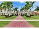 Expansive home with a tile roof, well manicured lawn, and gorgeous palm trees at 624 Balibay Rd, Apollo Beach, FL 33572