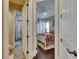 Hallway view showcases two bedrooms featuring dark hardwood floors and natural lighting at 624 Balibay Rd, Apollo Beach, FL 33572