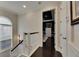 Hallway leading to a bedroom with a dark blue ceiling, white trim, and a glimpse of elegant decor at 624 Balibay Rd, Apollo Beach, FL 33572
