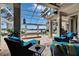 Screened lanai featuring waterfront views, comfortable seating, and a lovely pool at 624 Balibay Rd, Apollo Beach, FL 33572