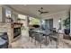 Covered outdoor seating area with fireplace, kitchen and dining areas at 624 Balibay Rd, Apollo Beach, FL 33572