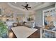 Large living room with arched entryways, tray ceilings, recessed lighting, and views into other rooms at 624 Balibay Rd, Apollo Beach, FL 33572