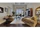 Inviting living room with dark wood floors and sliding glass doors to the outdoor entertaining area at 624 Balibay Rd, Apollo Beach, FL 33572