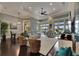 Comfortable living room featuring dark hardwood floors, neutral colors, and water view at 624 Balibay Rd, Apollo Beach, FL 33572