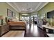 Spacious main bedroom suite with sitting area and private access to outdoor living at 624 Balibay Rd, Apollo Beach, FL 33572
