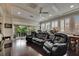 Entertainment room featuring a home theater, plush seating, hardwood floors, and recessed lighting at 624 Balibay Rd, Apollo Beach, FL 33572