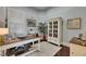 Cozy office area featuring custom built-ins, hardwood floors, and plenty of natural light at 624 Balibay Rd, Apollo Beach, FL 33572