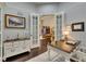 Spacious office area boasts French doors, hardwood floors, and custom built-in shelves at 624 Balibay Rd, Apollo Beach, FL 33572