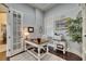 Well-lit office showcasing custom desk, French doors, and neutral color palette at 624 Balibay Rd, Apollo Beach, FL 33572