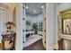 Bright office with French doors, tray ceilings, hardwood floors, and ample storage at 624 Balibay Rd, Apollo Beach, FL 33572