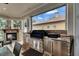 Outdoor kitchen features a built-in grill and stainless steel appliances at 624 Balibay Rd, Apollo Beach, FL 33572